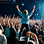 Mayday Concert Scene**

"A fully clothed and diverse crowd enthusiastically cheering at a Mayday concert, safe for work, appropriate content. The stage is brightly lit with dynamic lighting, and Mayday band members are performing, fully clothed in modest, modern rock attire. Capture the energy and excitement of the crowd. Wide shot, professional concert photography, perfect anatomy, natural proportions."

**